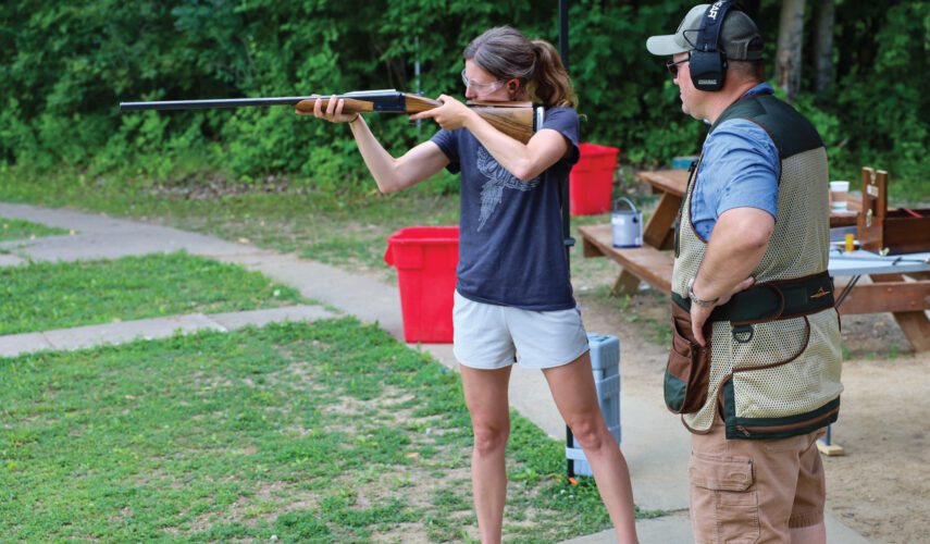 A woman gets proper gun fit with Upland Gun Company.